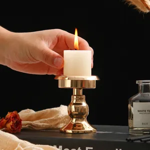 Minimalist gold metal candle holder for romantic dinner table decor, detail view