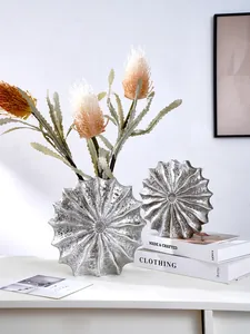 Elegant modern silver resin vase with conch texture for artistic home interior decoration