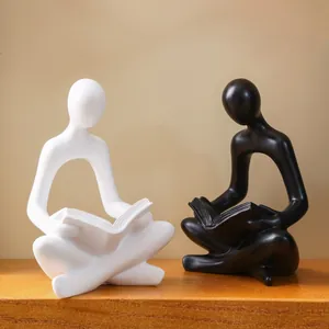 Modern minimalist black and white reading figurines set for tabletop home office decoration
