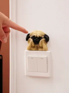 Cute pug dog resin wall sticker decoration for light switch in home interior.