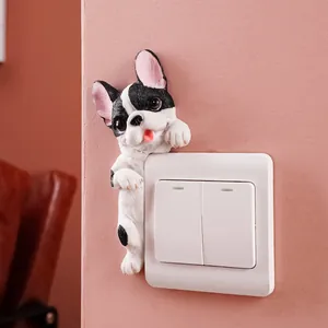 Adorable resin French Bulldog wall sticker decorating a white light switch panel