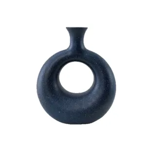 Jarrón de cerámica moderno con forma de dónut azul estrellado para hogar elegante