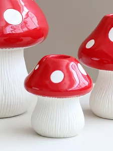 Close-up macro view of glossy red mushroom vases with white spots for creative home decor