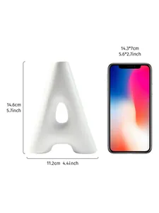 White A-shaped resin vase with dimensions shown next to a smartphone for scale