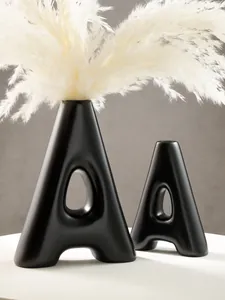 Modern minimalist black A-shaped resin vases set with dried pampas grass home decor