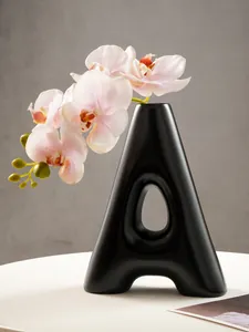 Modern matte black resin letter A vase for dried flowers and home aesthetic decor