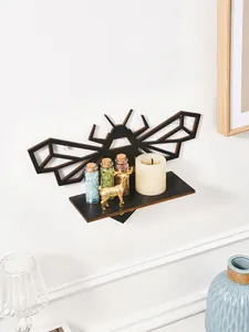 Black wooden bee-shaped wall shelf detail showing functional storage and decorative appeal