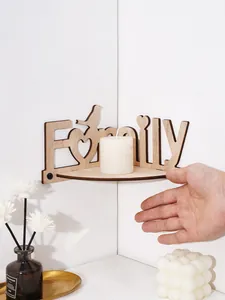Close-up of a wooden Family letter corner shelf with bird design and white candle