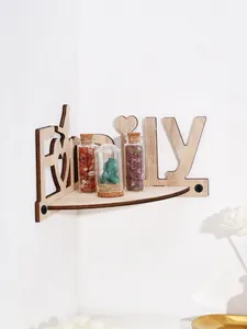 Close-up of wooden corner shelf featuring a decorative Family letter cutout design on white wall