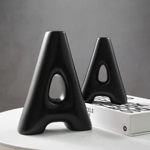 Modern minimalist matte black resin A-shaped decorative vase for chic home interior decor