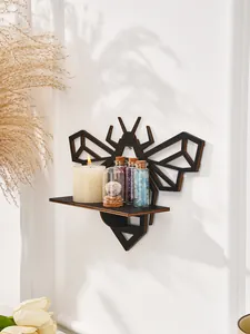 Bee-shaped wooden wall shelf displaying decorative crystals and candle