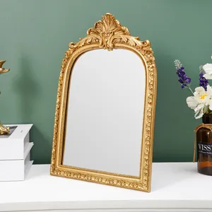 Vintage goldener verzierter Bogenspiegelrahmen für elegante Dekoration und Schmuckdisplay