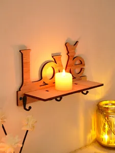 Close-up detail of wooden 'Love' wall mounted shelf with hooks and bird silhouette design
