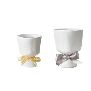 Minimalist bouquet-style white resin flower vases with elegant silk ribbon bows