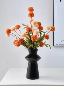 Minimalist black lighthouse-shaped resin flower vase for modern home tabletop decoration.