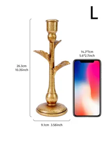 Vintage golden coconut tree candlestick dimensions shown with a smartphone for scale