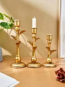Three-piece vintage gold palm tree candle holder set for elegant dining table decor