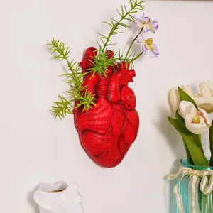 Jarrón de pared creativo con forma de corazón anatómico rojo con plantas para decoración de casa