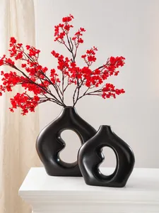Moderne schwarze Keramikvasen im Bohnendesign mit roten Kunstblumen Deko-Set