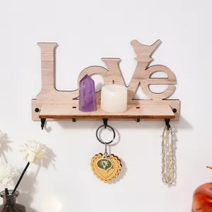 Wooden Love wall shelf with hooks and bird silhouette for creative home storage decor