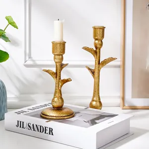 Vintage gold palm tree candle holders set for elegant home decor and wedding tables.