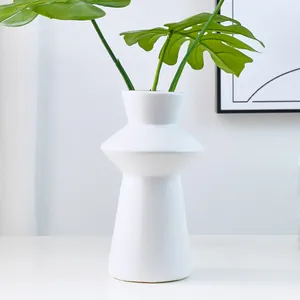 Nordic minimalist white lighthouse resin vase for modern creative home party decor.