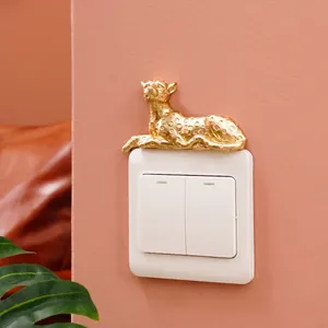 Macro view of golden leopard resin animal figurine as wall switch decorative sticker