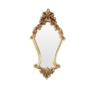 Vintage European style wall mirror featuring an ornate gold carved embossed frame for decor