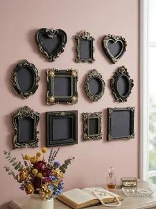 Vintage black and gold baroque mini frames set displayed on pink wall for home decor