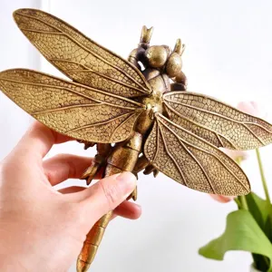 Handcrafted vintage bronze dragonfly wall ornament featuring intricate wing textures