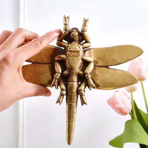 Detailed antique gold dragonfly wall hanging ornament with realistic wings and mount