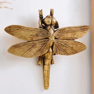 Vintage gold dragonfly insect wall hanging with detailed wing texture for home decor