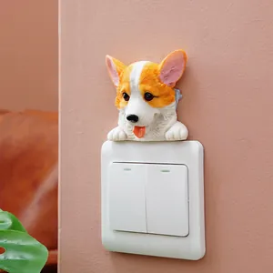Detailed macro shot of a 3D resin Corgi wall sticker on a light switch panel.