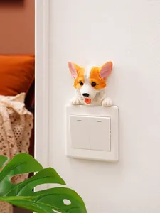 Decorative 3D corgi puppy resin wall sticker placed over a white light switch in a home