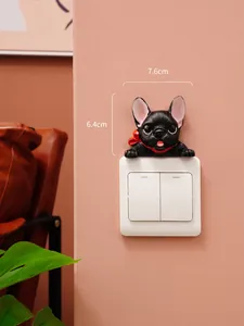 Detailed view of 7.6cm x 6.4cm black French Bulldog resin switch decoration on wall