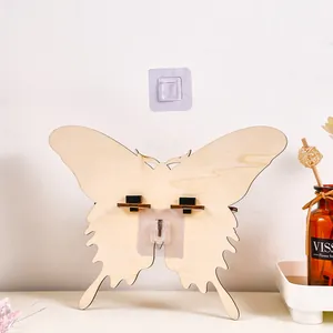 Wooden butterfly wall-mounted storage rack and candle holder, detailed view of home decor.
