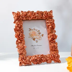 Elegant vintage bronze resin photo frame with intricate 3D rose carvings for 3.5x5 photos