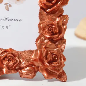 Macro detail of vintage copper resin frame with 3D rose carving and metallic finish