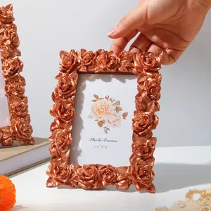 Vintage copper resin photo frame with intricate 3D rose carvings detail