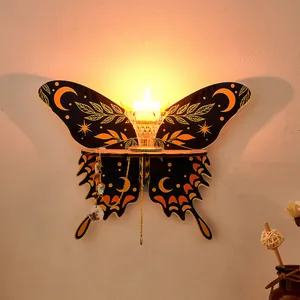 Wooden butterfly wall sconce candle holder detail, mystical moon and star wall decor shelf.