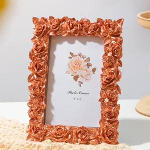 Detailed view of an ornate European retro bronze resin photo frame with 3D rose carvings