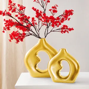 Moderne minimalistische goldene Keramikvasen im Bohnendesign für Wohnzimmer Deko