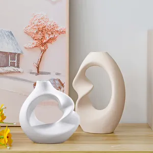 Modern Nordic abstract resin vases with spiral hollow design for home and office decor