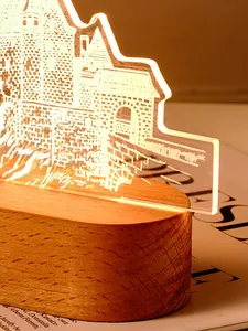 Detailansicht der Schloss-Gravur einer Acryl 3D Nachtlampe mit einem Sockel aus Massivholz
