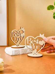 Macro view of laser-cut wooden heart ornaments featuring Best Dad and Best Mum texts