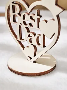 Heart-shaped wooden ornament with 'Best Dad' laser-cut text for Father's Day gift decoration.