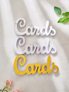 Detail view of 3D script 'Cards' signs in silver mirror, white, and gold PVC foam board.