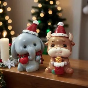 Weihnachtsfiguren aus Harz: Elefant und Stier für festliche Tischdekoration zu Hause