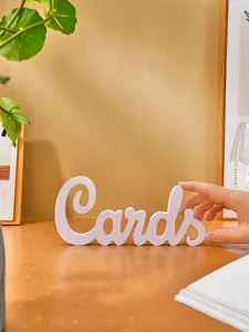 Detailed close-up of a white minimalist PVC 'Cards' letter sign for home art decor