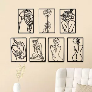 Minimalistische Wanddeko aus schwarzem Metall mit Frauenfiguren und Blumen, 7er Set.